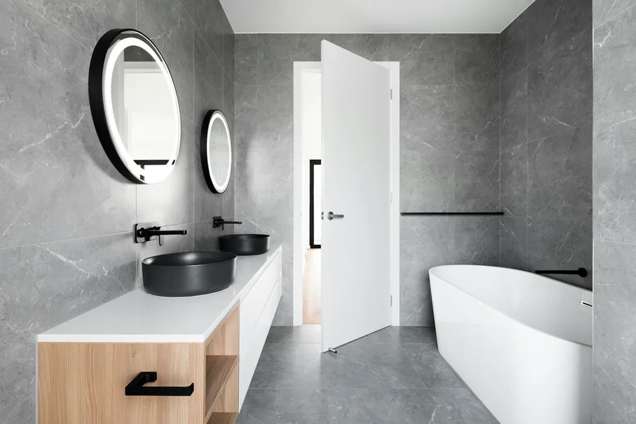 Contemporary bathroom with glass shower and considered lighting